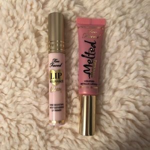 Two too faced lipsticks.One clear and one pink
